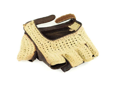 Old retro leather driving fingerless glove isolated on whiteの写真素材