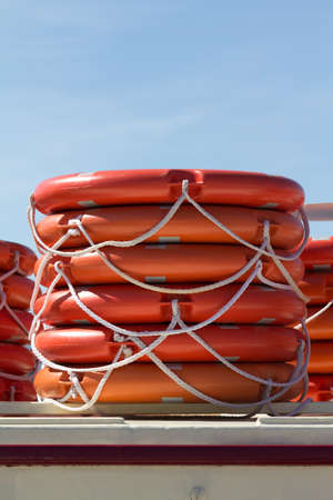 Stacked lifebelts on a sunny dayの写真素材