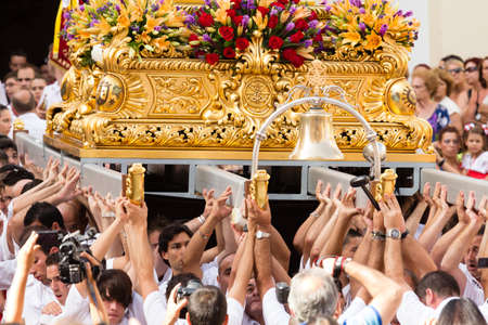 MALAGA, SPAIN - JULY 16: Unidentified local worshippers lift a religious image out of the church...