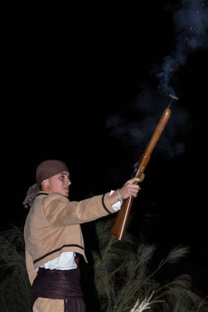 MALAGA, SPAIN - OCTOBER 13: Unidentified bandit firing at Pasion Bandolera reenactment of 1840
