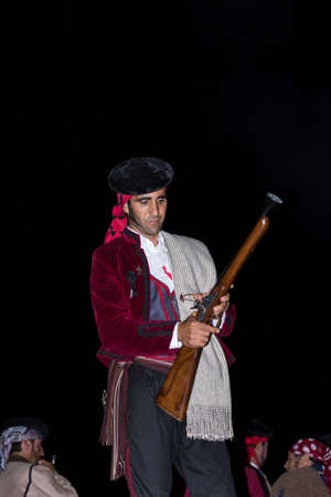 MALAGA, SPAIN - OCTOBER 13: Unidentified bandit reloading his blunderbuss at Pasion Bandolera reenactment of 1840のeditorial素材