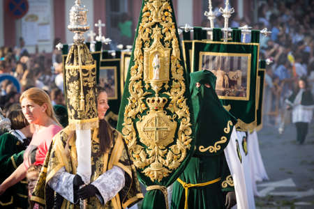 MALAGA, SPAIN - APRIL 18: Unidentified worshipers during the Holy Week parade celebration in Alhaurin de la Torre streets on April 18, 2014 in Malaga, Spain.のeditorial素材