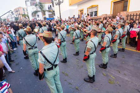 MALAGA, SPAIN - APRIL 18: Unidentified spanish legionnaires playing cornets during an Easter parade on April 18, 2014 in Alhaurin de la Torre, Malaga, Spain.のeditorial素材
