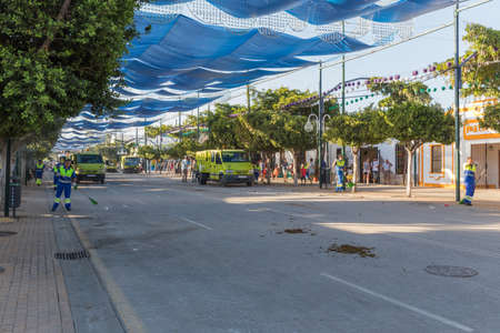 MALAGA, SPAIN - AUGUST 21, 2014: Squad cleaning the streets at the august fair of Malagaのeditorial素材