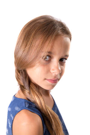 Young girl with long hair posing with a sober look