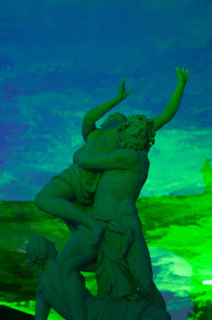 VERSAILLES - JULY 21: Rape of Proserpine by Pluto under a green laser at The Fountains Night Show on July 21, 2012 in Versaillesのeditorial素材