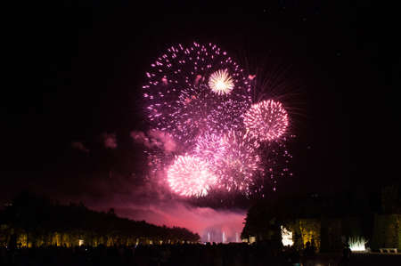 VERSAILLES - JULY 21: Red Fireworks at The Fountains Night Show on July 21, 2012 in Versailles