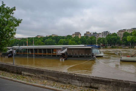 PARIS - JUNE 4: Paris flood with high water on June 4, 2016 in Paris, France. Large view on the Parisian boatsのeditorial素材