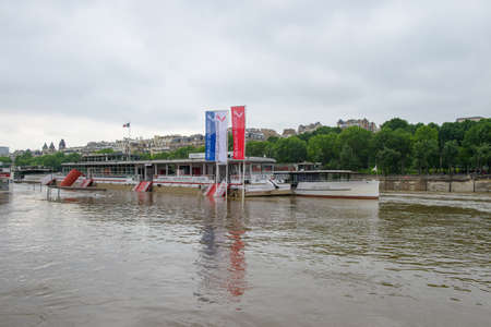 PARIS, FRANCE - JUNE 4: Paris flood with high water on June 4, 2016 in Paris, France. Vedettes de Paris boat #5のeditorial素材