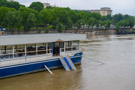 PARIS, FRANCE - JUNE 4: Paris flood with high water on June 4, 2016 in Paris, France. Cercle de la Mer Boatのeditorial素材