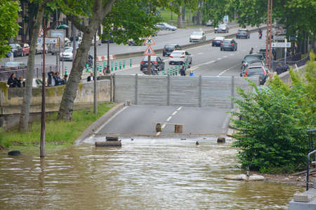 PARIS, FRANCE - JUNE 4: Paris flood with high water on June 4, 2016 in Paris, France. Flooded road.のeditorial素材