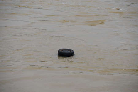 PARIS, FRANCE - JUNE 4: Paris flood with high water on June 4, 2016 in Paris, France. car tires floating in the waterのeditorial素材