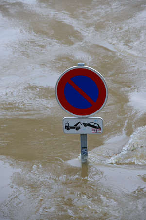PARIS, FRANCE - JUNE 4: Paris flood with high water on June 4, 2016 in Paris, France. Road sign underwaterのeditorial素材