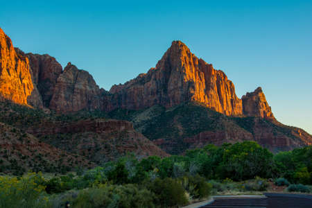 Red Sunset in Zion National Park green and orange colours with blue skyの写真素材