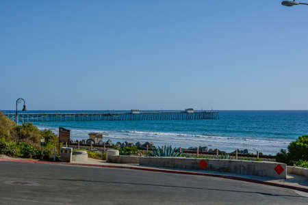 Scenic San Clemente Ocean side close to pier and rails pacific surflinerの写真素材