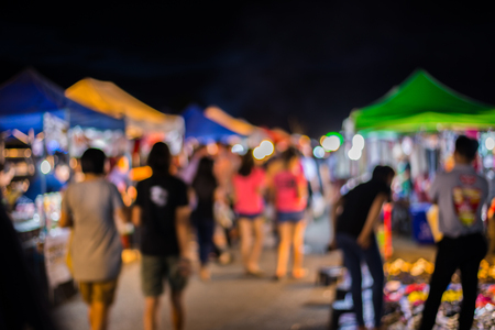 Blurry image of night market on street background with bokehの写真素材
