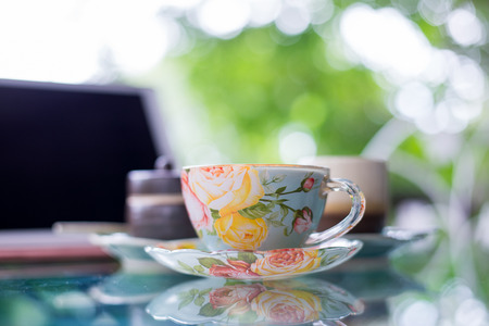 Cup of hot drink with coffee on table.の写真素材