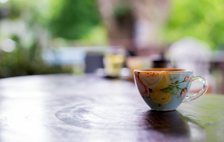 Cup of hot drink with coffee on table.の写真素材