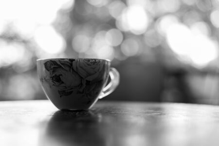 Cup of hot coffee on black and white color tone with clarity.の写真素材