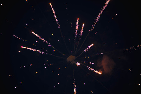 Fireworks. Stars and shiny fireworks on red background.の写真素材
