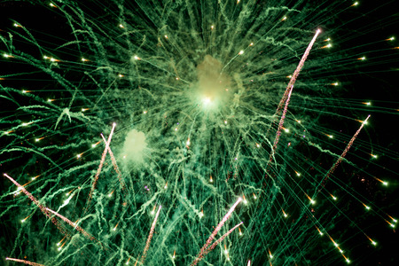 Fireworks. Stars and shiny fireworks on red background.の写真素材