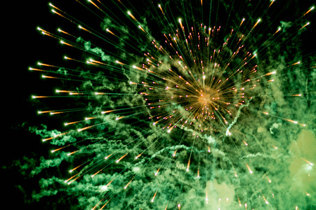 Fireworks. Stars and shiny fireworks on red background.の写真素材