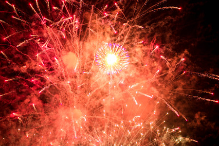 Fireworks. Stars and shiny fireworks on red background.の写真素材