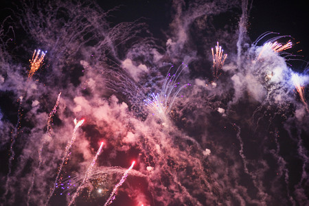 Fireworks. Stars and shiny fireworks on red background.の写真素材