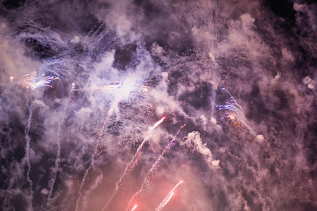 Fireworks. Stars and shiny fireworks on red background.の写真素材