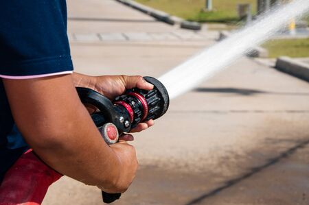 Firefighters spray waterの写真素材
