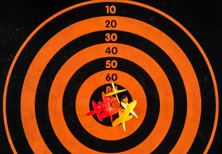 darts arrows in the target centerの写真素材