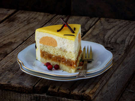 Piece of cake with cheese mousse and caramel cream covered with a mirror coating. Niigata cake. selective focus.の写真素材