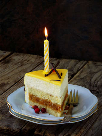 piece of cake and candle burning. Niigata cake. Copy space. selective focus.