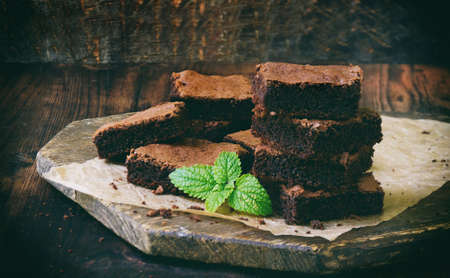 pieces of cake chocolate brownies on wooden background. selective focus. copy space.の写真素材