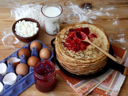 pancakes with cottage cheese and jam on a wooden background. Maslenitsa.の写真素材