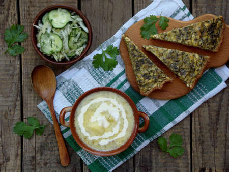 soup of zucchini, cabbage salad and spinach pieの写真素材