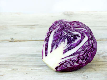 Purple cabbage on a light wooden backgroundの写真素材
