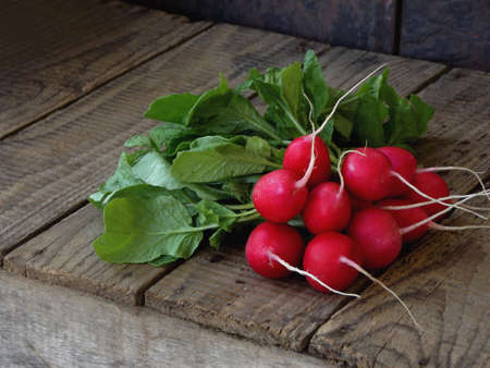 fresh radish flat on wooden background lay, top view