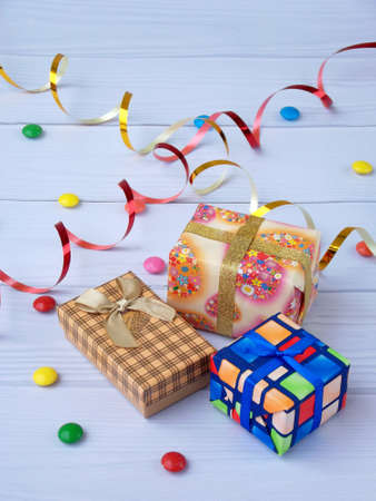 three gifts on a light wooden background. Birthdayの写真素材