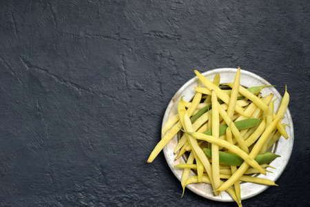 Fresh bio organic asparagus beans on metal plate. Healthy food. Copy space. Mockup for menu or recipe.の写真素材