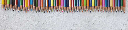 Pattern of color pencils isolated on white background. Close up.