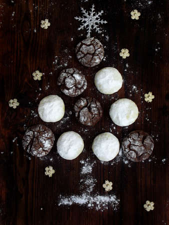Christmas tree built of cookies chocolate with cracks and white shortbread. Advent cakes. New Year,...