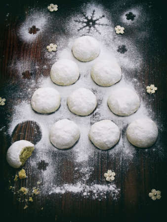 Christmas tree built of cookies white shortbread with green tea matcha. New Year and Xmas card....