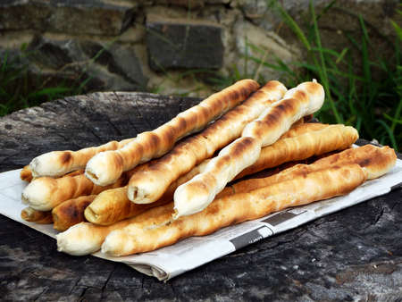 Bread sticks of dough cooked on a fire. Italian breadsticks. Selective focus