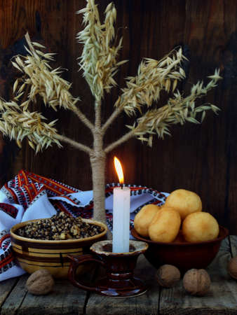 Composition of xmas symbol kutya wheat porridge with poppy and nuts , pampushki pies , uzvar compote...