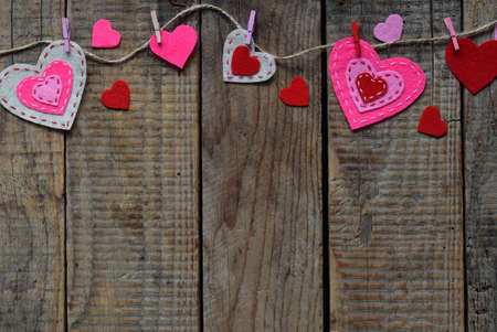Valentine's Day background with handmade felt hearts, clothespins. Valentine gift making, diy hobby....