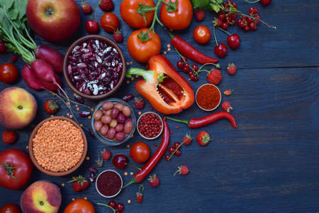 Collection of fresh red fruits, vegetables and bean. Healthy food concept. Vegetarian product. Organic Raw Produceの写真素材