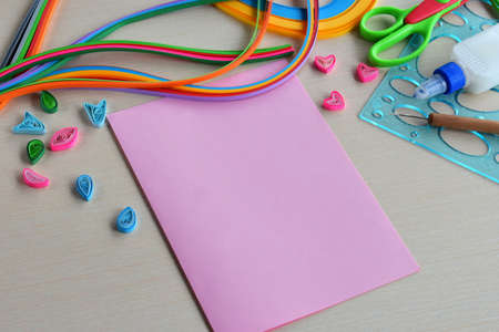 Quilling technique. Handmade crafts on holiday: Birthday, Mother's or Father's Day, March 8, Wedding. Children's DIY concept. Preparation of materials, elements for making greeting card. Step 1の写真素材