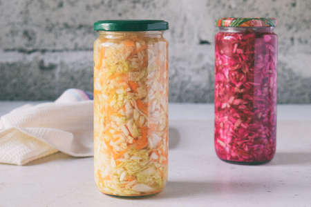Sauerkraut in glass jar, marinated cabbage, carrot and beetroot. Probiotic and fermented food. Pickles. Canned vegetarian food conceptの写真素材