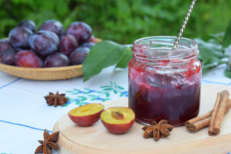 Plum jam with star anise and cinnamon. Fruit marmalade. Autumn canning and preserving. Conservation of harvest. Organic healthy vegetarian foodの写真素材